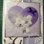 Feathers & Orchids Wedding card. Orchids hand cut and embossed in parchment, Dies used include Sizzix originals Hearts dies, cuttlebug divine swirl embossing folder and Quickutz Horseshoe die. - craftybabscreativecrafts.co.uk