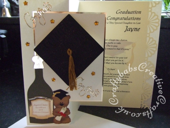 A4 Graduation Card with Pop up front, made using a variety of dies including Custom made wooden champagne bottle die, Go Kreate Boo Bear die, Custom made graduation die, Spellbinders labels 2 dies, Cuttlebug 'Congratulations embossing folder and sentiment die from Cuttlebug cut & emboss everyday greetings set. - craftybabscreativecrafts.co.uk