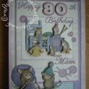A4 House-Mouse Decoupage 80th Birthday card made using Joanna Sheen House-Mouse CD Roms and various dies including; Sizzix originals numbers dies, Britannia Happy Birthday sentiment dies, Cheery Lynn Delicate Lace Script Alphabet dies, Buttons and knitting dies from X-Cut Haberdashery die set. - craftybabscreativecrafts.co.uk