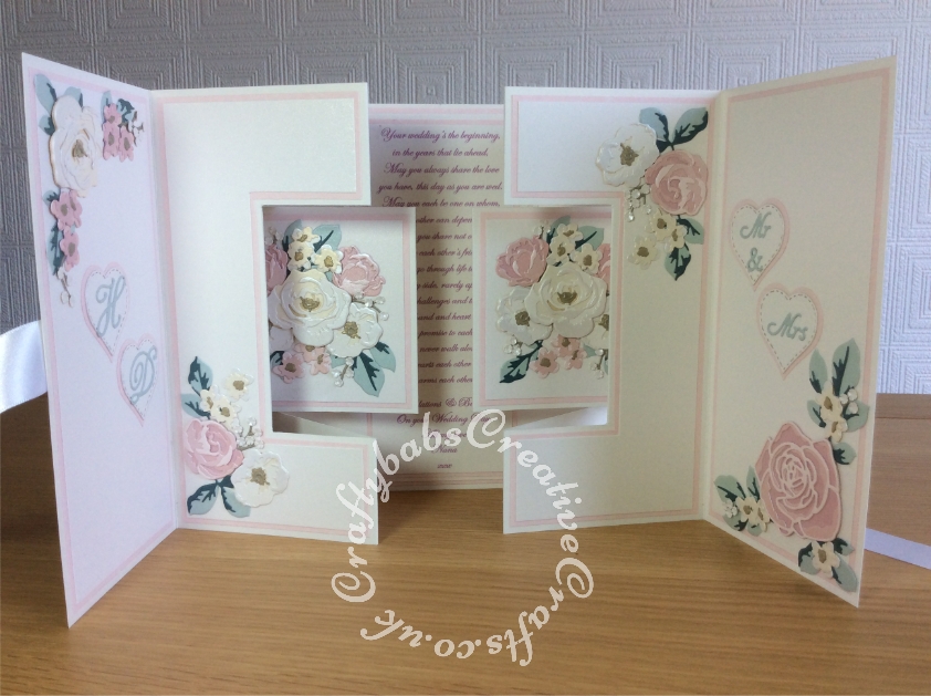 XL 8" x 8" Double Shutter Wedding Card made using various dies including Card making Magic Die Set Christmas Rose by Christina Griffiths, Alt-e-new Layered Rose die set, free with issue 174 of Simply Cards & Papercraft magazine, Altenew - Garden Picks 3D Die Set, Nellie Snellen Multi Frame Cutting Die 060 -Straight Heart, Nesting stitched heart dies, Cheery Lynn Designs Die - Build a Flower Embellishment #2, Spellbinders nesting plain and scalloped hearts dies, Cheery Lynn 'Delicate Lace Script' Alphabet, - craftybabscreativecrafts.co.uk