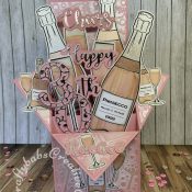 Pink Prosecco themed Pop Up Box card made using various digi-stamps from Craftworld Premium members free digi-stamps cheers collection, dies including; CARD MAKING MAGIC DIE SETS SOLID & OVERLAY NUMBER & SUFFIX, i Craft Cheers & Happy dies, embossing folder and stamps from Issue 161 of Simply cards & Papercraft magazine and Crafters companion Gemini Expressions Metal Die – Uppercase and lower case Alphabet Sets. - craftybabscreativecrafts.co.uk