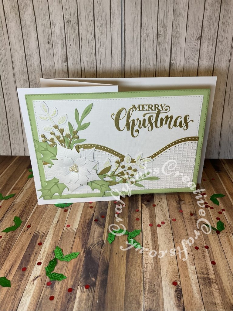 Christmas card inspired by a card I saw on Pinterest by https://bluerosepapertreasures.blogspot.com/2020/08/ornate-poinsettia-cards.html made using various dies including:- Spellbinders Borderabilities Curved borders, Spellbinders - Shapeabilities - Layered Poinsettia, Bright Rosa Sprigs and foliage dies, Pretty Quick Holly dies from Wreath making set, Sue Wilson Mini Expressions Stacked Merry Christmas Craft Die, unbranded nesting stitched rectangle dies and Crafters Companion Hessian embossing folder. - craftybabscreativecrafts.co.uk