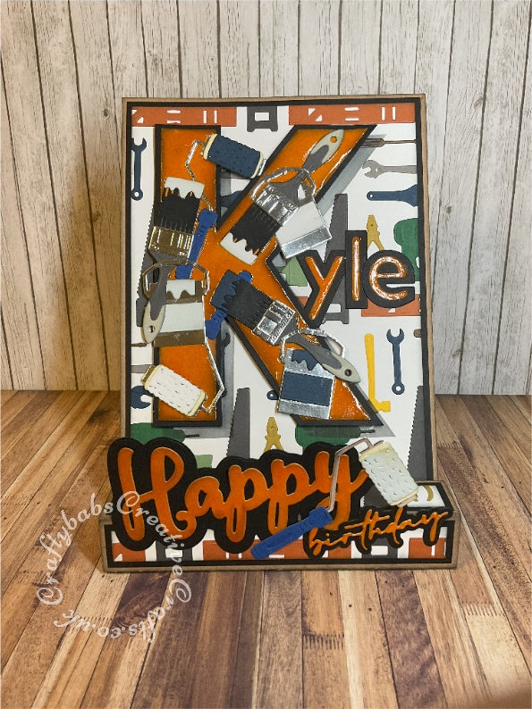 Masculine Box Easel card made using various dies including Creative 'Happy' sentiment, unbranded birthday sentiment dies, Spellbinders Die All The Tools Toolbox Essentials for Paint brushes, paint cans and paint rollers, Background created using Creative Expressions Sue Wilson Necessities - In The Tool Box Die set. The large 'K' was hand cut and the remaining letters cut using the Craft Buddy Nested Lowercase alphabet die set - craftybabscreativecrafts.co.uk