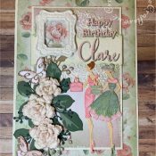 Vintage style birthday card made using various dies including: Heartfelt Creations Vintage floret dies for roses, Altenew JUmbo Garden Picks and Garden picks dies for leaves, unbranded dies for berry foliage, Tattered Lace sentiments 2014 for 'Happy Birthday' Sizzix Thinlits Elle Upper and Lower case Alphabet dies for name, Cardmaking Magic Petunia Wrap die for lace background, Poppy Stamps Devyn Butterfly trio dies and Tattered Lace 3D Pretty Party Dress Die Set. Frame made with WRMK Mold and paperclay. - craftybabscreativecrafts.co.uk